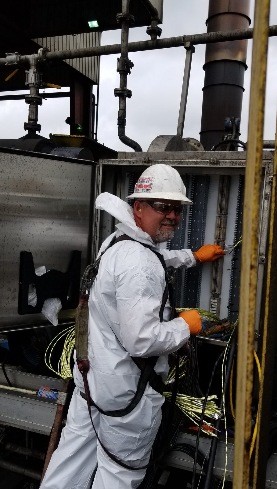 Ed Wheat in a Wheat Electric hard hat wiring outdoor terminal strips